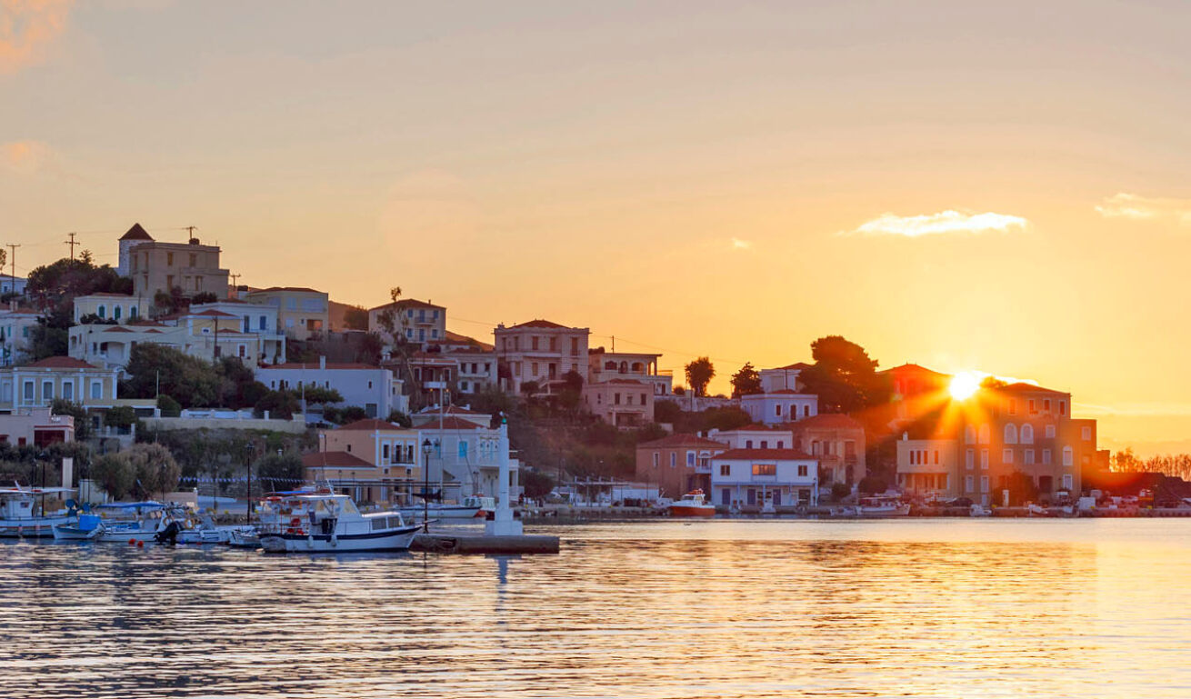 View of Oinousses with the port during sunset