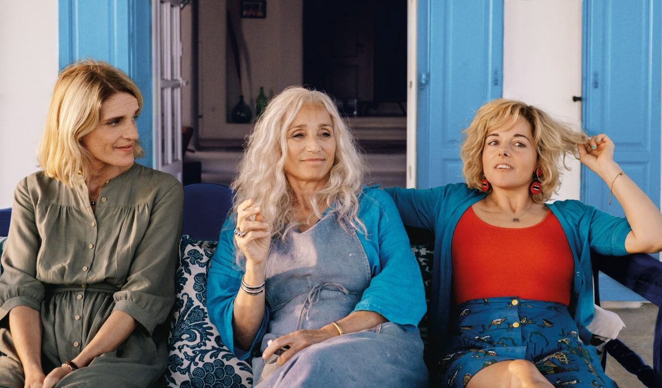 three women sitting next to each other