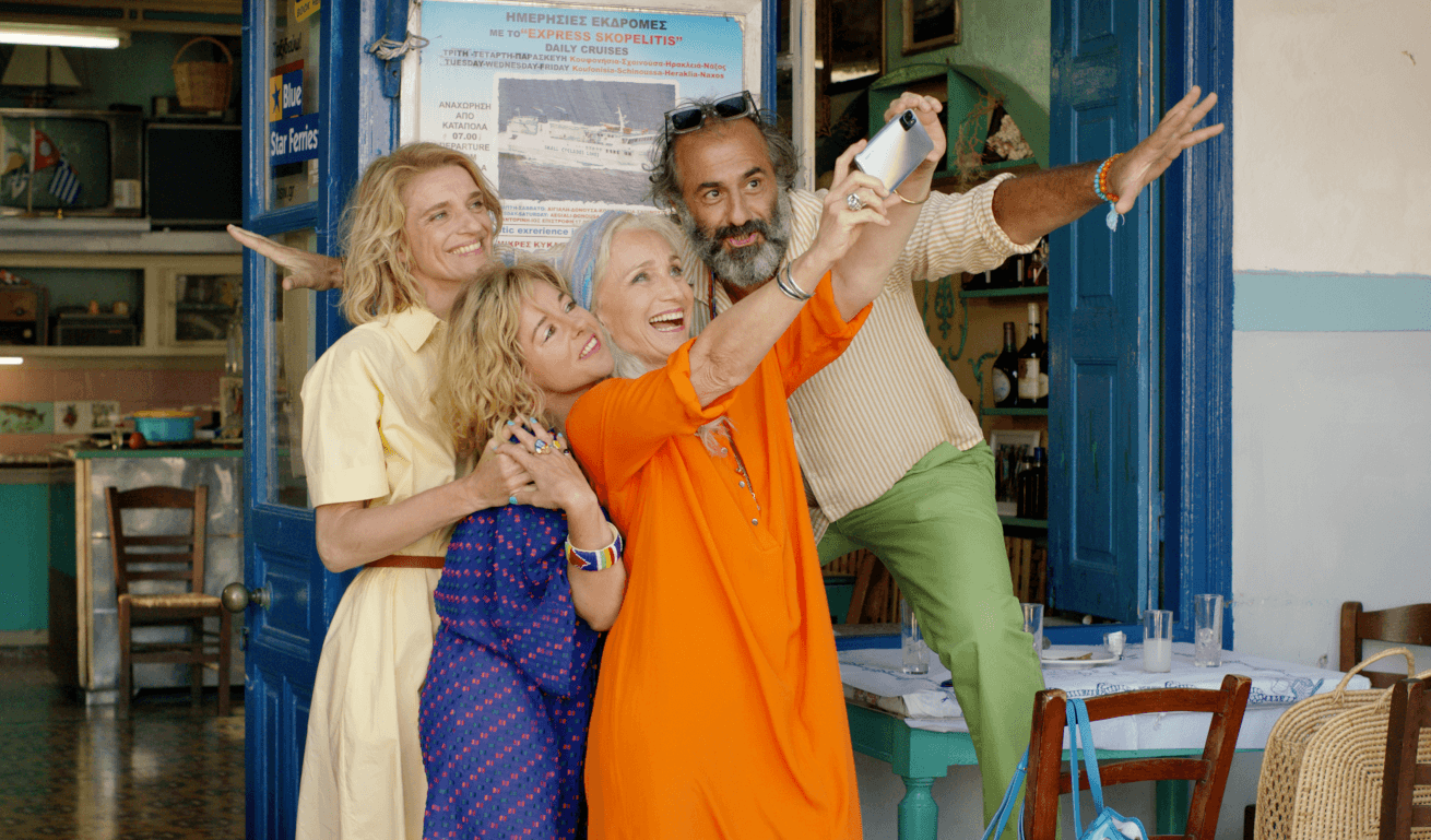 four people taking a selfie