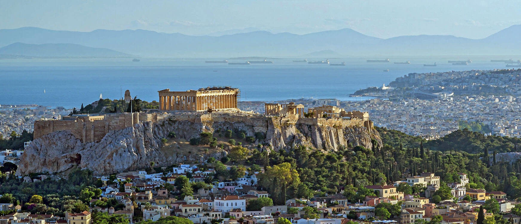 View of Athens with picturesque houses and in the background Acropolis is seen 