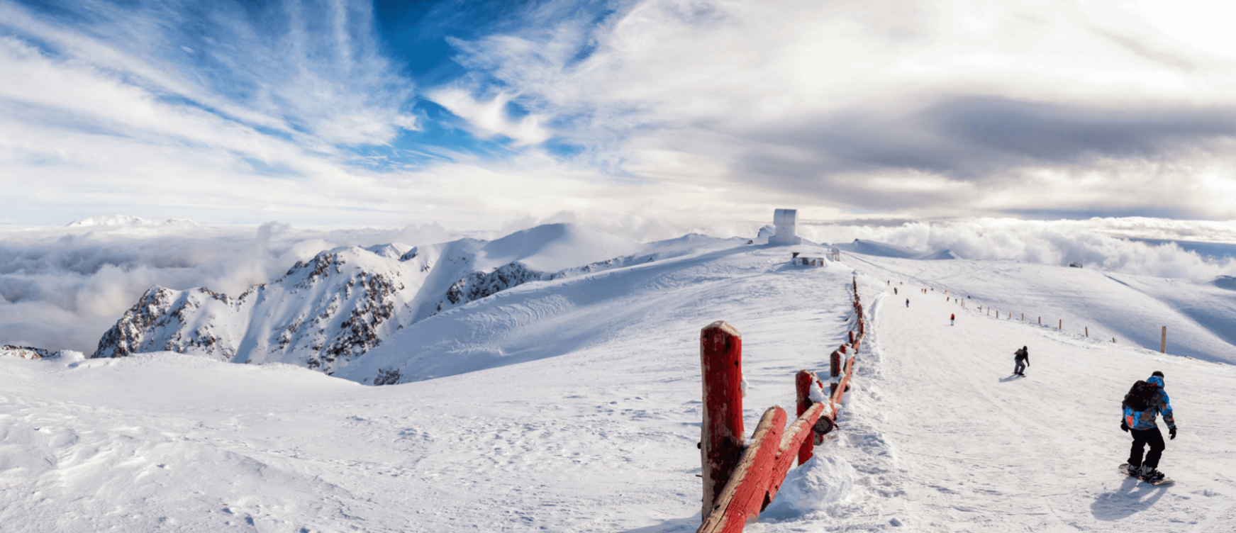 Snowy slope with skiers