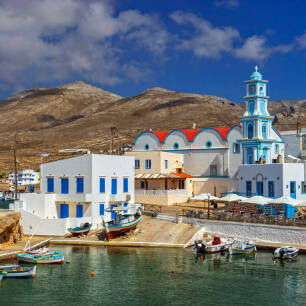 Kasos port with the traditional whitewashed houses and the church in the background