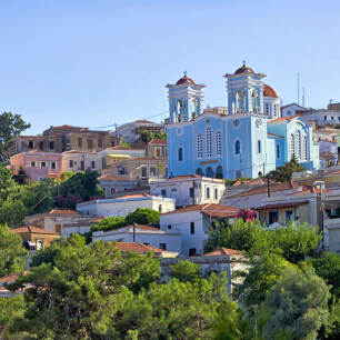 A view of Oinousses with traditional houses and the church in the background