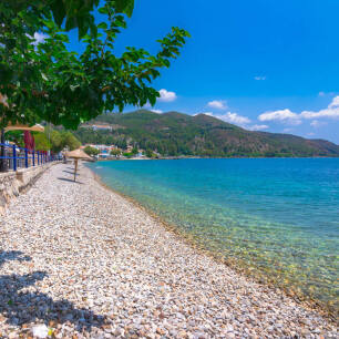 Tiny seaside town with a pebbled beach and greenish blue sea waters