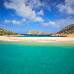 A beach with greenish blue waters in the islet of Kounoupi near Astypalaia