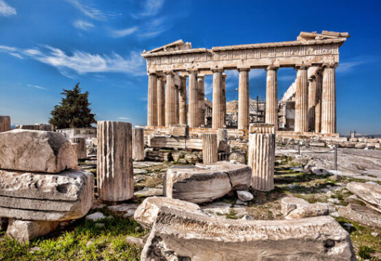 Archaeological site with ruins and a large temple. 