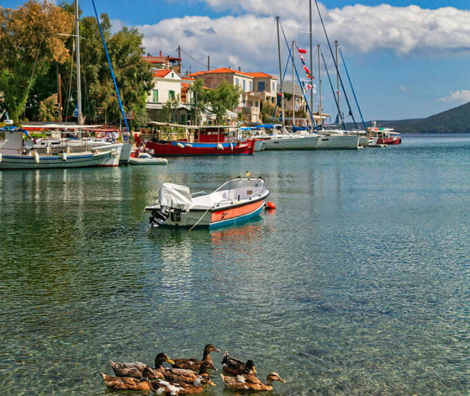 Picturesque village of the island with many fishing boats and greenish blue waters