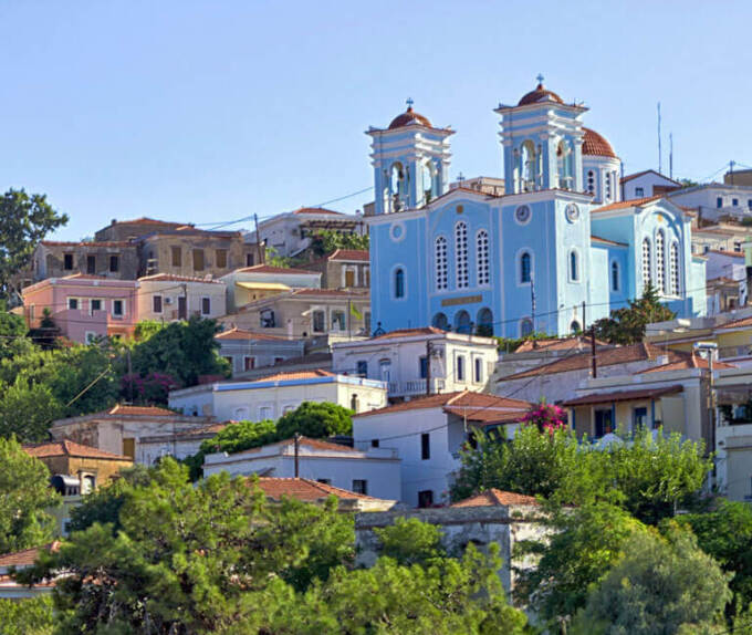 A view of Oinousses with traditional houses and the church in the background