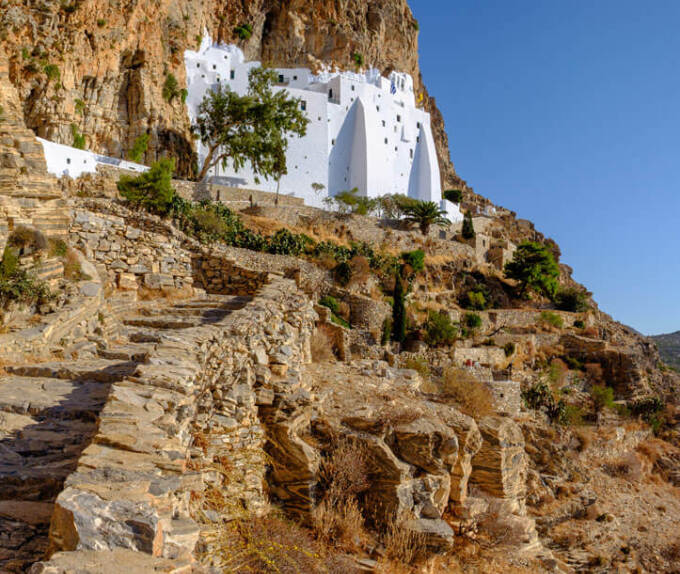 Large white church on high cliffs above the sea 