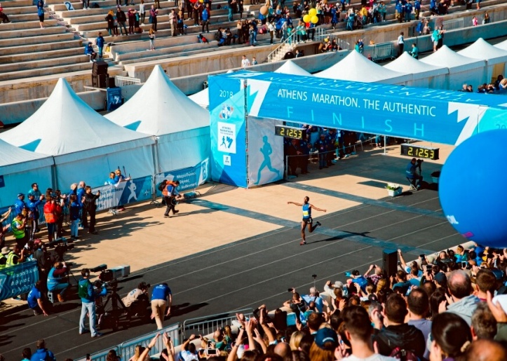 a man running the finishing line of marathon 